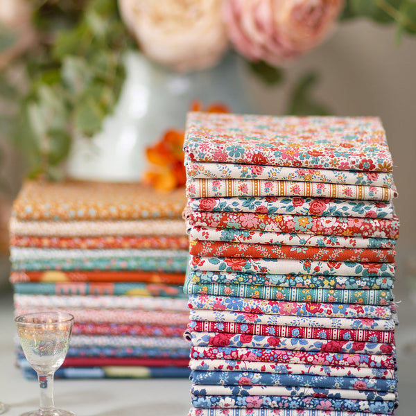 Stack of quilting fabrics from an online fabric store in Australia